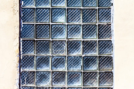 Old grunge glass blocks wall as background texture