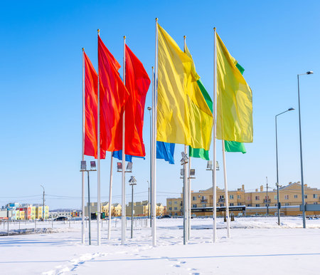 Samara, Russia - March 11, 2018: Colorful flags waving on the city street in winterのeditorial素材