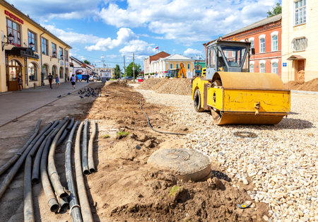 Borovichi, Russia - July 22, 2019: Road roller working on the construction of new road at the city...
