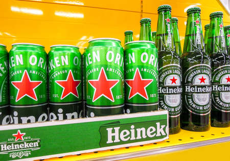 Samara, Russia - March 18, 2020: Heineken alcoholic beer ready for sale on the shelf in superstore. Various bottled alcoholic beverages and spirit drinksのeditorial素材