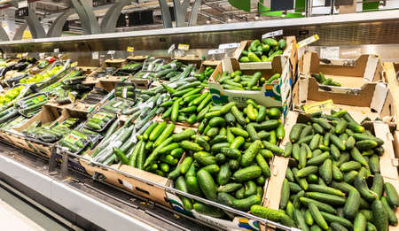 Samara, Russia - June 1, 2019: Fresh cucumbers ready for sale in superstoreのeditorial素材