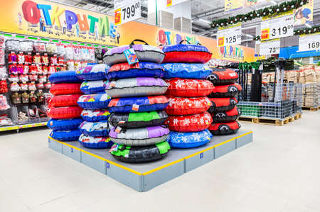 Samara, Russia - November 23, 2019: Different colorful snow tubes ready for sale at the storeのeditorial素材