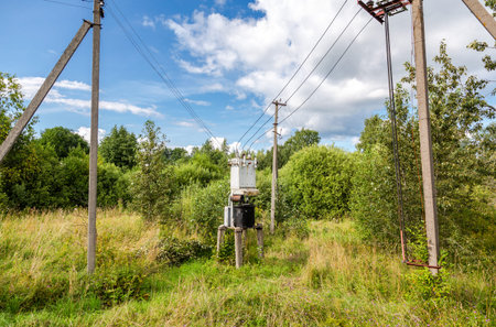Old voltage power transformer substation at the russian village. Distribution of electricity....