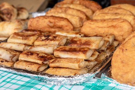 Fresh appetizing delicious fried pies and filling pancakes
