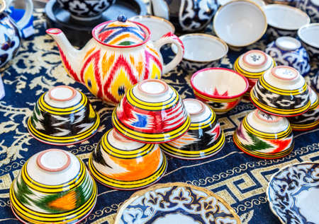 Samara, Russia - October 5, 2019: Ethnic Uzbek ceramics tableware on the table. Decorative ceramic with traditional uzbekistan ornamentのeditorial素材
