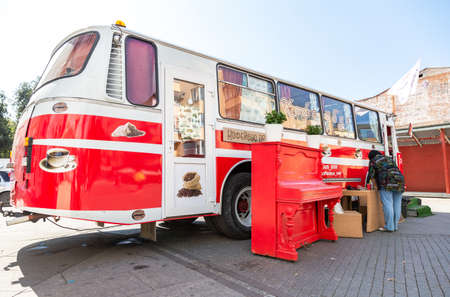 Samara, Russia - September 7, 2019: Food truck, mobile drink and snack van in a city street in summer sunny day. Text in Russian: Coffee busのeditorial素材