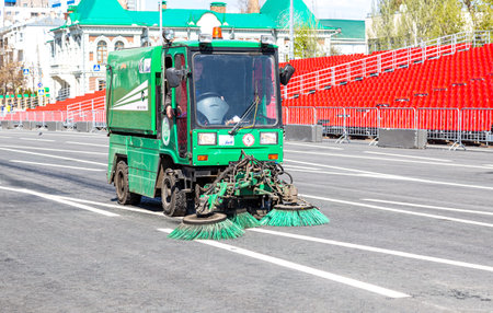 Samara, Russia - May 1, 2019: Street sweeper machine cleans street with brushes and waterのeditorial素材