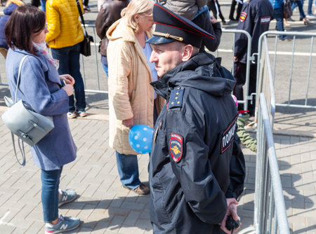 Samara, Russia - May 1, 2019: Unidentified Russian policeman in uniform watching the rule of law during the demonstration on labor dayのeditorial素材