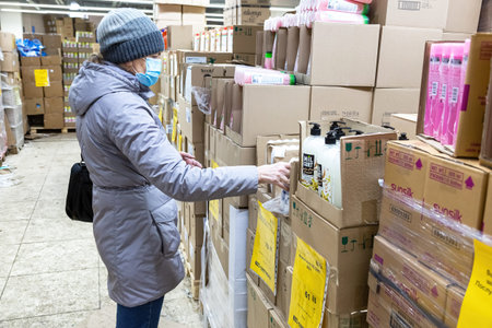 Samara, Russia - January 2, 202: Woman shopping in the Svetofor retail discounter. Retail warehouse store in Russia, selling food, furniture and housewaresのeditorial素材