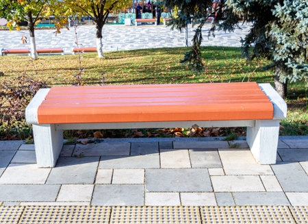 Wooden bench at the city street in summer sunny dayの写真素材