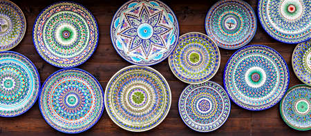 Samara, Russia - June 4, 2016: Ethnic Uzbek ceramic round plates with traditional Uzbek ornaments. Decorative ceramic plates with patternsのeditorial素材