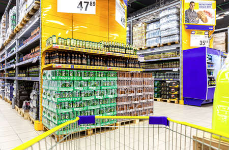 Samara, Russia - June 4, 2016: Alcoholic beverages. Shelves of beverage, domestic and imported beer cans and bottles at the Lenta storeのeditorial素材