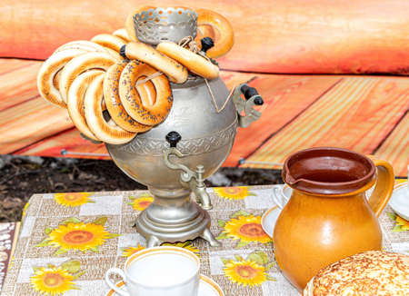 Samara, Russia - March 13, 2016: Appetizing tasty bagels on the traditional russian samovar on the tableのeditorial素材