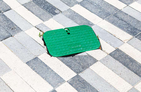 Samara, Russia - May 29, 2020: Sidewalk access hatch coverのeditorial素材