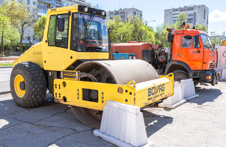 Samara, Russia - May 13, 2017: Road roller at the construction of new road in summer sunny day
