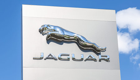 Samara, Russia - May 13, 2017: Jaguar dealership sign against the blue sky. Jaguar is a brand of the...