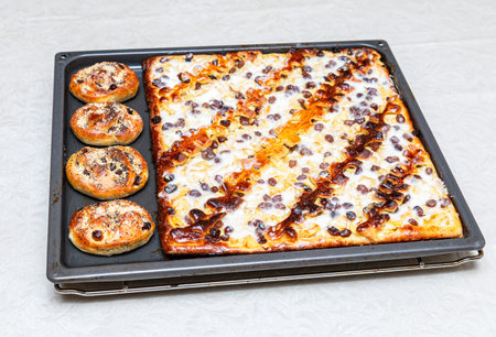 Fresh homemade delicious pies on a metal baking sheet