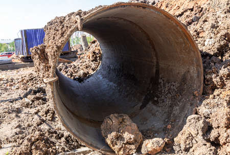 Repair and replacement of underground communications on the city street. Replacement pipes of the heating main in summertimeの写真素材