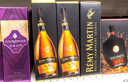 Samara, Russia - May 15, 2021: Remy Martin cognac is sold in the store. Various bottled alcoholic beverages in boxesのeditorial素材