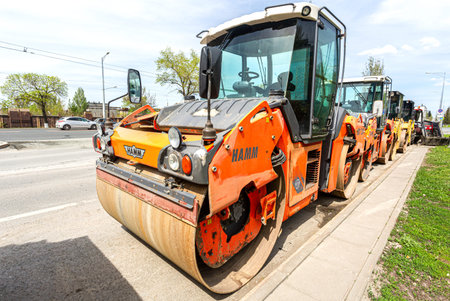 Samara, Russia - May 10, 2021: Heavy road rollers working on the construction of new road. Industry...