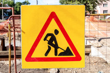 Road works traffic sign at the city street. Road under constructionの写真素材
