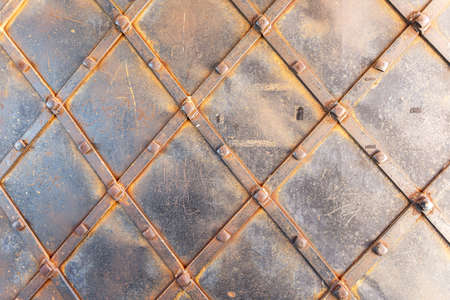 Rusty metal texture as background with streaks of rust. Old gate of iron covered with rustの写真素材