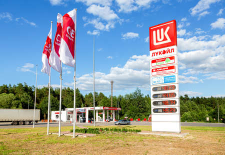 Mordovia, Russia - July 6, 2021: Lukoil gas station with fueling cars. Lukoil is one of the largest russian oil companiesのeditorial素材