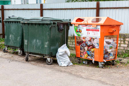Borovichi, Russia - September 15, 2021: Different containers for separate waste collection. Text in russian: Container for plastic vialsのeditorial素材