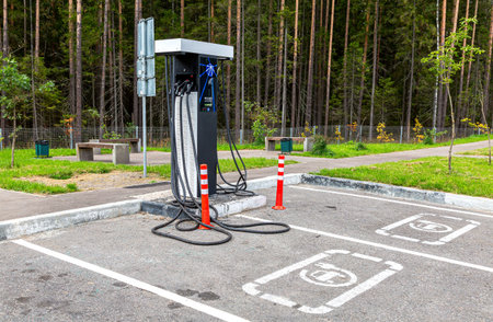 Moscow, Russia - July 19, 2021: Electric vehicle charging station at the car parking lot on the highway M11のeditorial素材