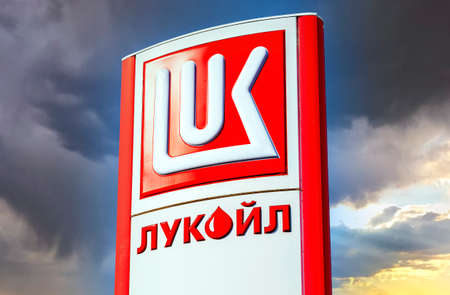Saint Petersburg, Russia - August 10, 2018: Lukoil dealership sign against a blue sky. Lukoil is one of the largest russian oil companiesのeditorial素材