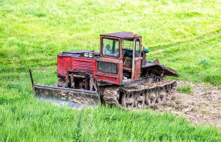 Old skidder at the outdoors in summertime. Skidding machine for timber industryの写真素材