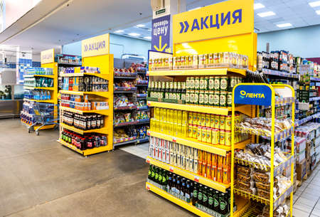 Novgorod, Russia - August 30, 2021: Different beer cans with cool fresh beer ready for sale in Lenta store. Text in Russian: Promotion in the storeのeditorial素材
