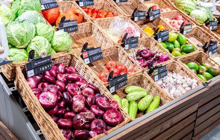 Samara, Russia - October 10, 2021: Fresh red onion, cabbage, tomatoes and other vegetables sale in a chain superstoreのeditorial素材
