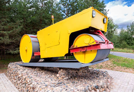 Borovichi, Russia - July 23, 2021: Road roller on a pedestal as a monumentのeditorial素材