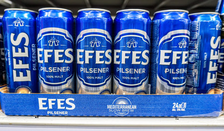 Samara, Russia - March 17, 2022: Efes alcoholic canned beer on the shelf in superstore. Various...