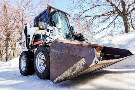 Samara, Russia - March 26, 2022: Bobcat loader vehicle at the city street in winter. Bobcat Company is an American-based manufacturer of farm and construction equipmentのeditorial素材