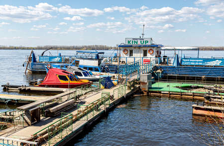 Samara, Russia - May 3, 2022: Kin Up pier on the Volga river with motor boats on a spring sunny dayのeditorial素材