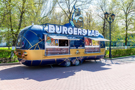 Samara, Russia - May 3, 2022: Food truck. Mobile drink and snack van in a city park in summer sunny...