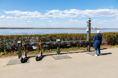 Samara, Russia - May 3, 2022: Electric Ride Sharing Scooters at the City Street and Ready to Rent