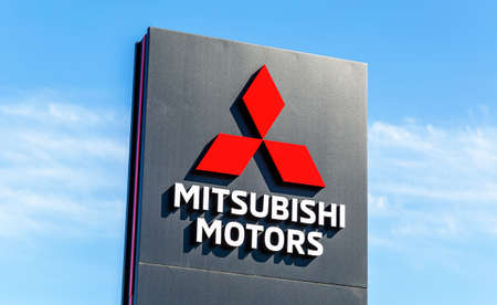 Samara, Russia - May 07, 2022: Official dealership sign Mitsubishi motors against a blue skyのeditorial素材