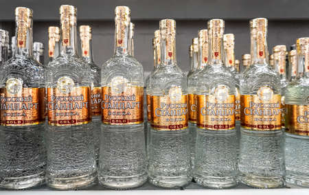 Samara, Russia - May 5, 2022: Russian Standard vodka ready for sale on the shelf in a superstore. Various bottled alcoholic beverages and spirit drinks. selective focusのeditorial素材