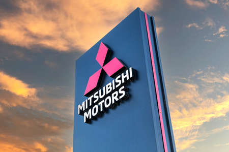 Samara, Russia - May 07, 2022: Official dealership signboard Mitsubishi Motors against a sunset skyのeditorial素材