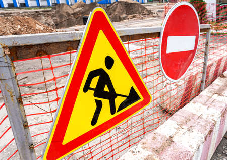 Road works traffic sign at the city street. Under construction road signの写真素材