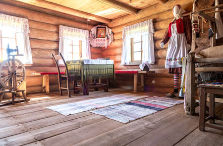 Samara, Russia - September 25, 2021: Ethnocultural complex "People's Friendship Park". Interior of traditional Udmurt wooden house built from wood logsのeditorial素材