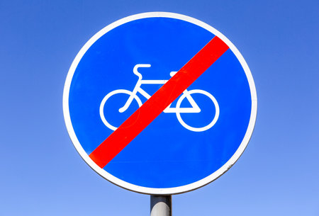 Not allowed sign for bikes lane against the blue sky. No bicycle warning signの写真素材