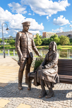 Borovichi, Russia - July 17, 2022: Bronze monument to a red army officer and a nurseのeditorial素材