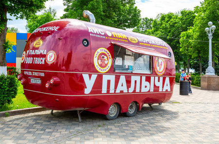 Samara, Russia - June 4, 2022: Food truck, mobile drink and snack van in a city park in summer sunny dayのeditorial素材