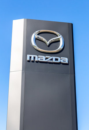 Samara, Russia - May 08, 2022: Mazda dealership sign against a blue sky backgroundのeditorial素材