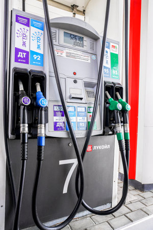 Samara, Russia - July 12, 2022: Filling column with pistols with different types of fuel at the lukoil gas stationのeditorial素材