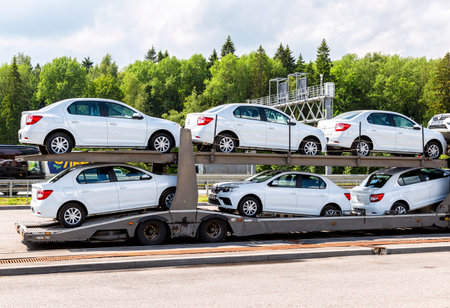 Moscow, Russia - July 12, 2022: Car transporter carries new Renault vehicles along the highway. Car carrier transporter truck on a freewayのeditorial素材